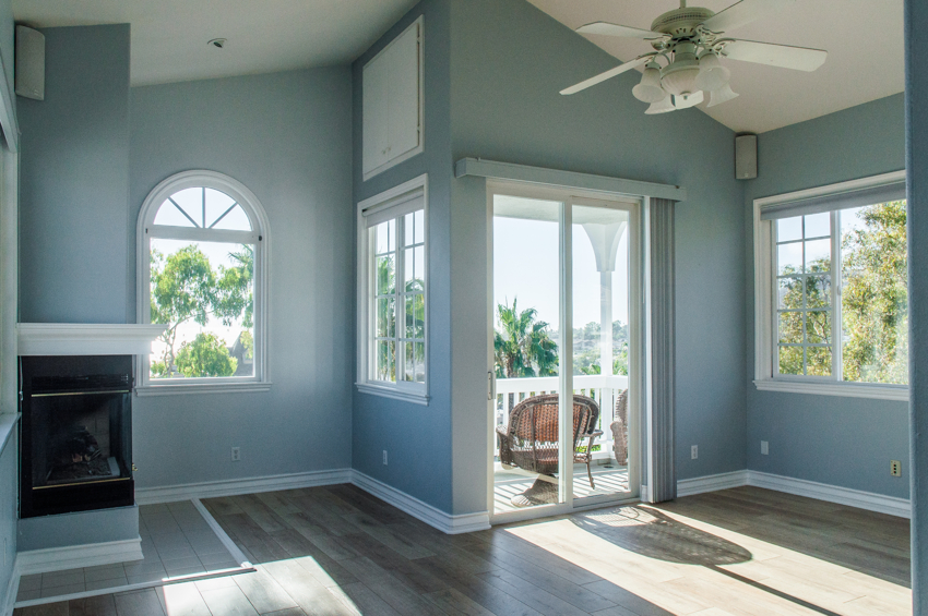 trendy-modern-interior-living-room-with-blue-walls-white-windows (1)